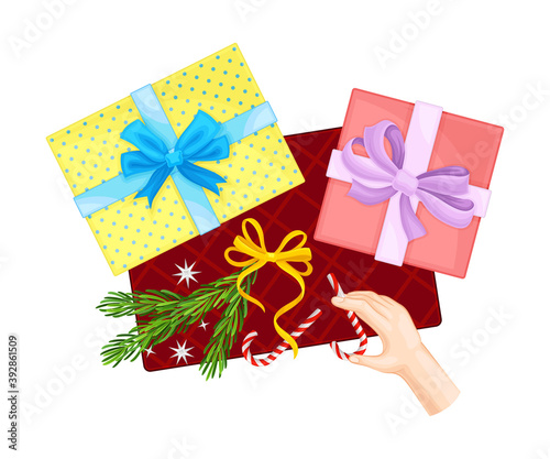 Wrapped Gift Boxes with Hand Holding Candy Stick Above View Vector Illustration