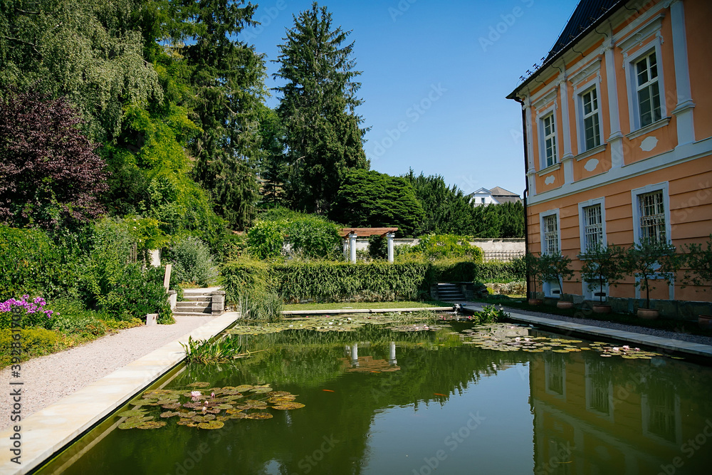 Pink Rococo Chateau Nove Hrady, Сastle with French garden called Small Schonbrunn or Czech Versailles near Litomysl in summer sunny day, Pardubice region, Czech Republic