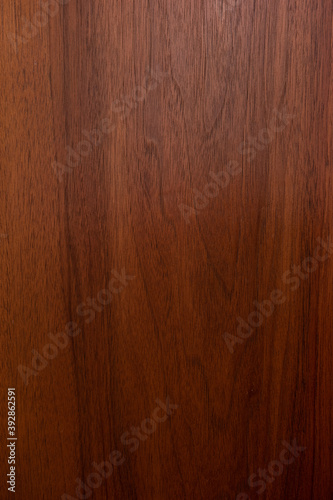 Dark brown wood grain texture abstract close up front view