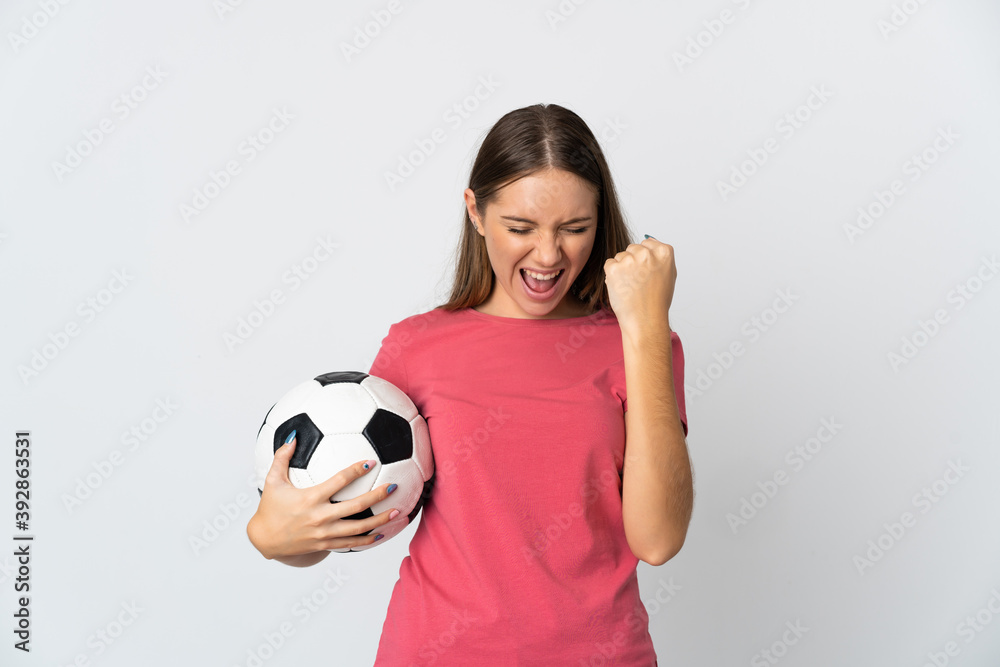 Young Lithuanian woman isolated on white background with soccer ball celebrating a victory Young Lithuanian woman isolated on white background with soccer ball celebrating a victory