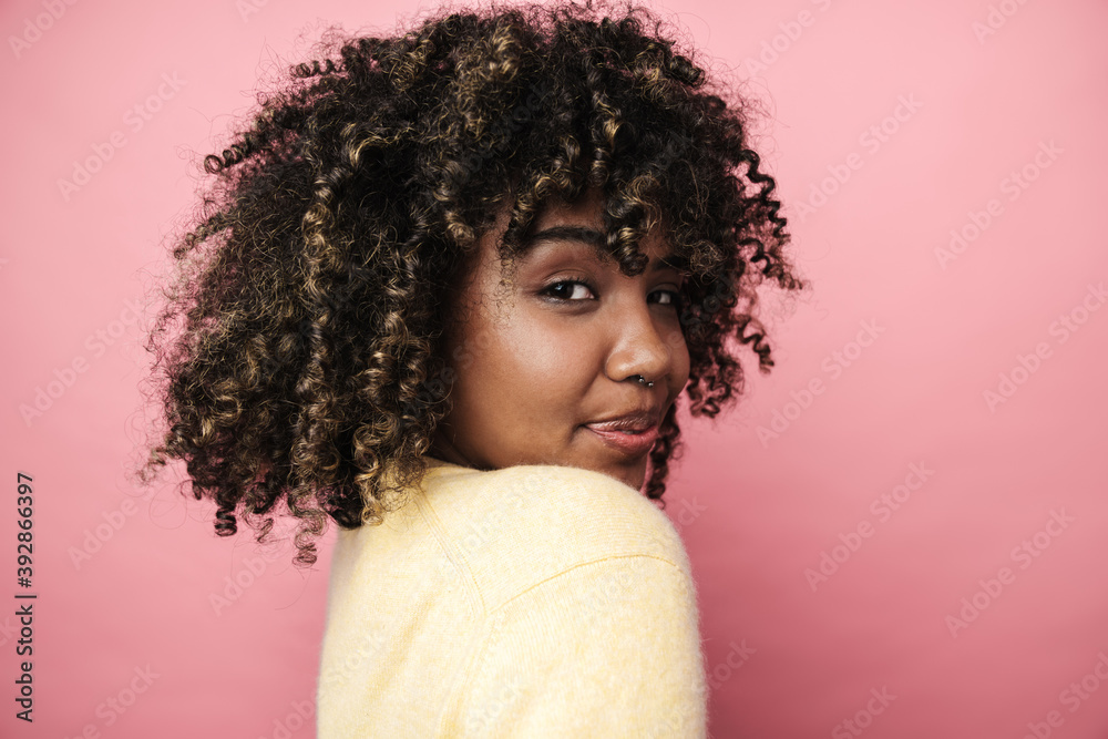 Pleased african american woman posing and looking at camera