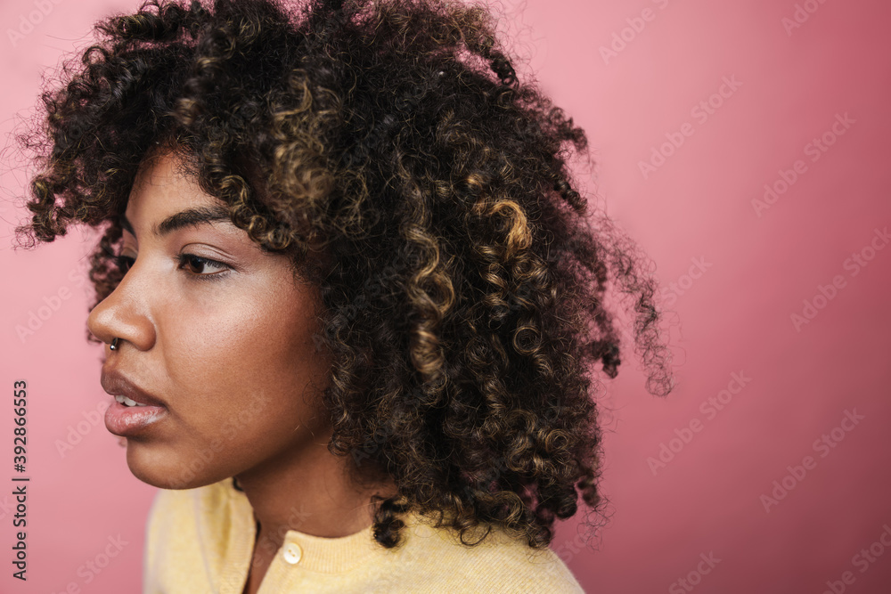 Fototapeta premium Serious african american woman posing and looking aside