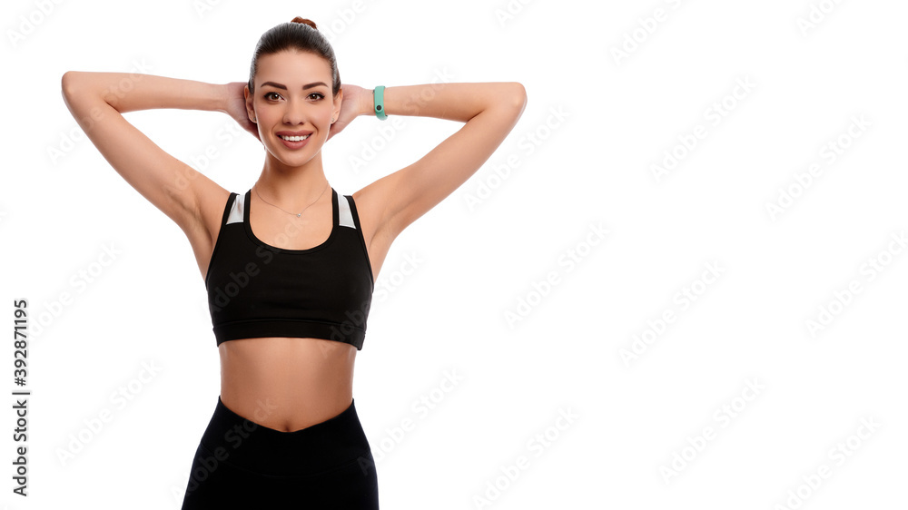 Fit strong sportswoman stretching hands on white isolated background. Fitness female doing physical exercise and smile. Healthcare and weight loss concept Fit strong sportswoman stretching hands on white isolated background. Fitness female doing physical exercise and smile. Healthcare and weight loss concept