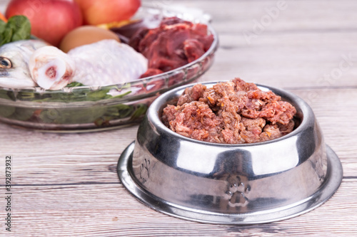 Valokuva Minced barf raw food recipe ingredients for dogs consisting meat, organs, fish,
