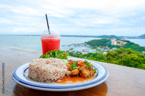 Seafood fried rice with red sweet juice and sea view