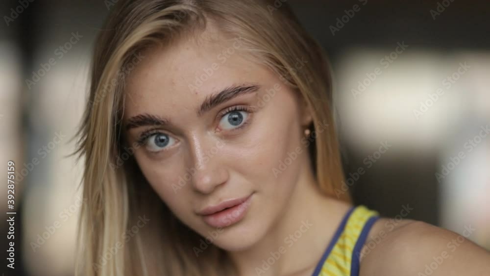 Large portrait of an attractive young girl with blond hair. Girls with beautiful eyes looking at the camera Large portrait of an attractive young girl with blond hair. Girls with beautiful eyes looking at the camera