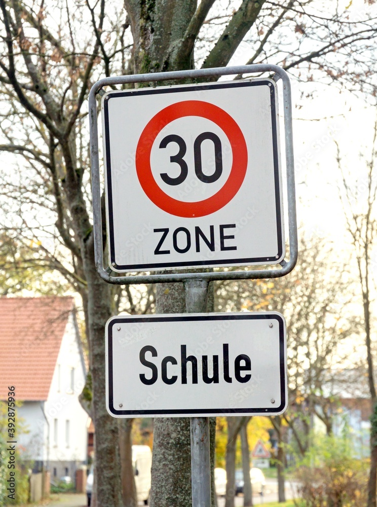 A 30km/h speed limit traffic road sign for a school area in Germany