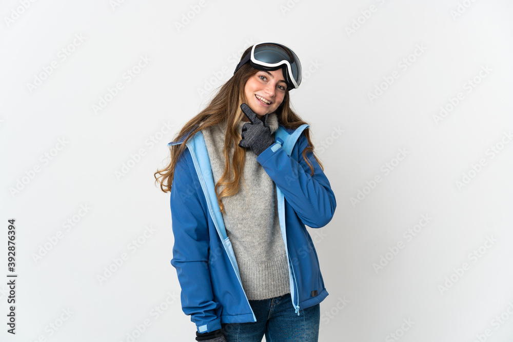Skier girl with snowboarding glasses isolated on white background happy and smiling Skier girl with snowboarding glasses isolated on white background happy and smiling