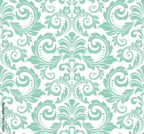 Wallpaper in the style of Baroque. Seamless vector background. White and green floral ornament. Graphic pattern for fabric  wallpaper  packaging. Ornate Damask flower ornament
