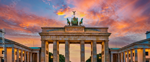 Panorama of the Brandenburg gate illuminated at sunset in Berlin, Germany photo