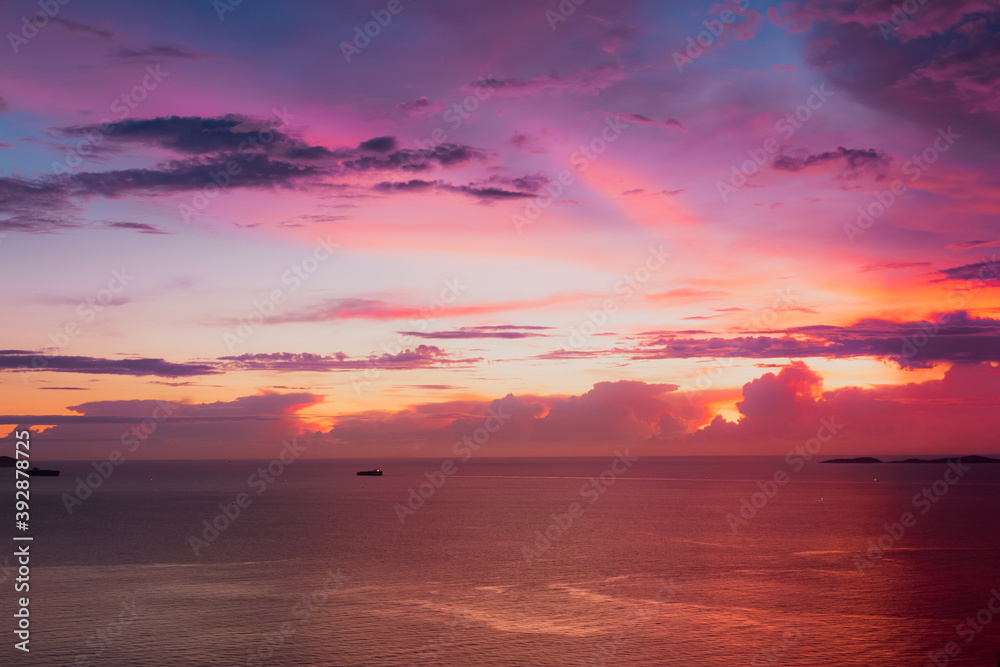 View from Koh Larn island overlooking the Gulf of Thailand during sunset time with a beautiful colorful sky.