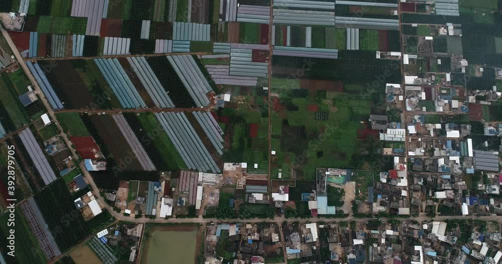 aerial view of agricultural plots of land under cultivation in an agricultural town. Mengzi, Yunnan Province, China aerial view of agricultural plots of land under cultivation in an agricultural town. Mengzi, Yunnan Province, China