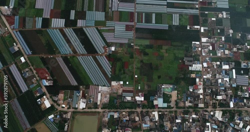 aerial view of agricultural plots of land under cultivation in an agricultural town. Mengzi, Yunnan Province, China photo