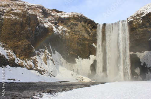 Winter waterfall rainbow, Iceland