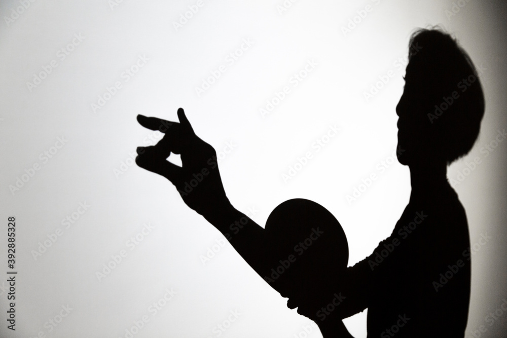 play shadow projected against a white background, a snail play shadow projected against a white background, a snail