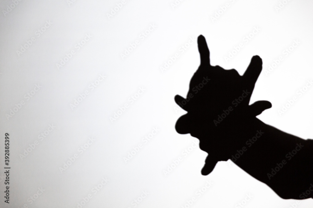 play shadow projected against a white background, a demon play shadow projected against a white background, a demon
