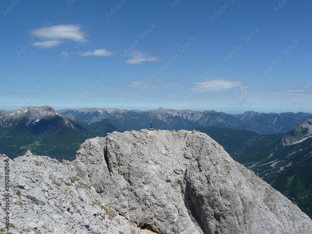 Summit cross of Ehrwalder Sonnenspitze mountain in Austria Summit cross of Ehrwalder Sonnenspitze mountain in Austria