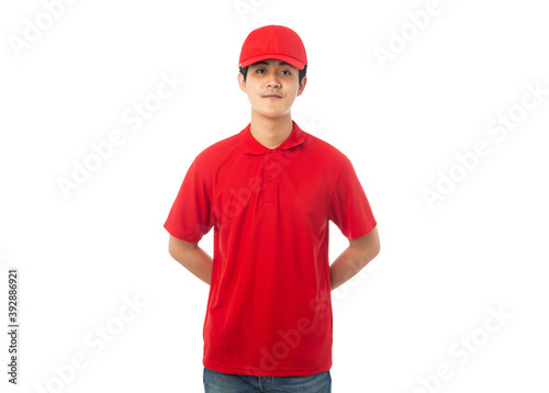 Young Delivery man in red uniform isolated on white background with clipping path.
