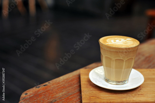 Cup of coffee on table in cafe - vintage style effect picture