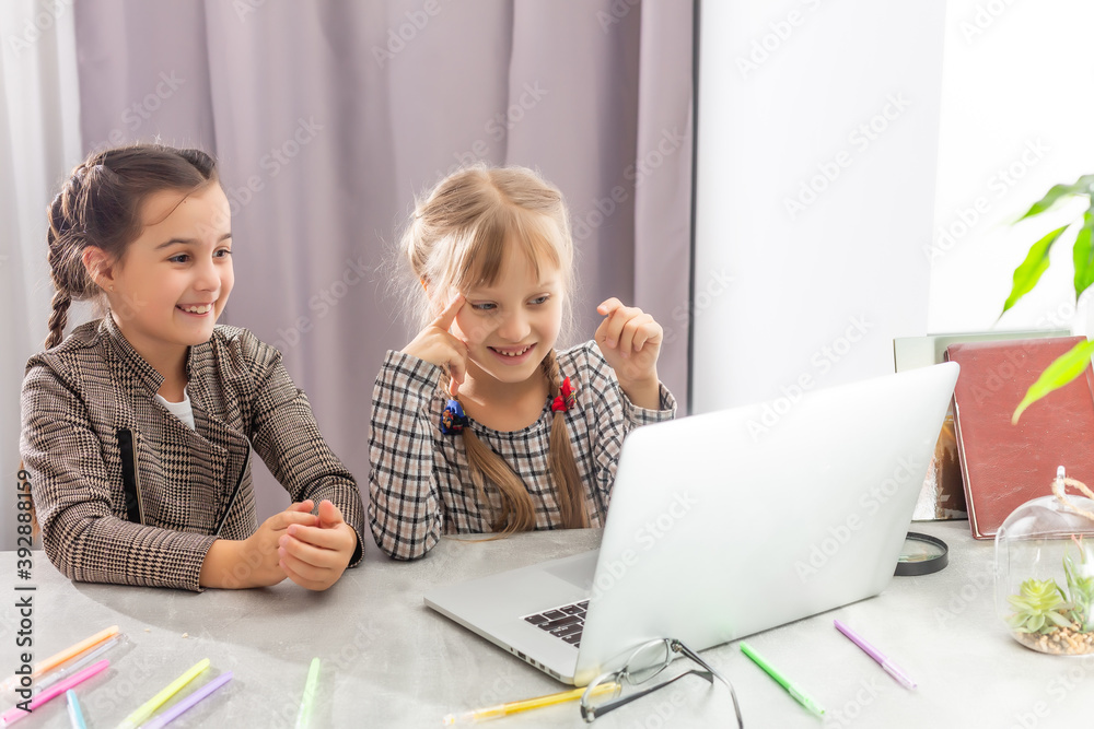 two little girls studying online. Distance Learning Online, e-learning, concept two little girls studying online. Distance Learning Online, e-learning, concept