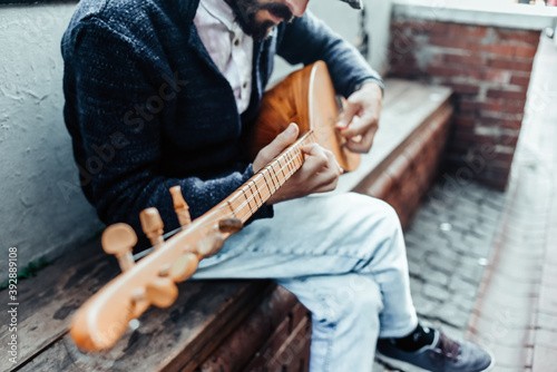 Photography a street musician in Istanbul plays the dutar