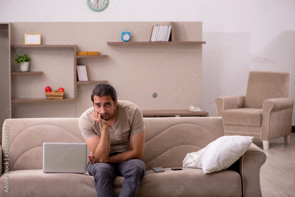 Young male freelancer working at home