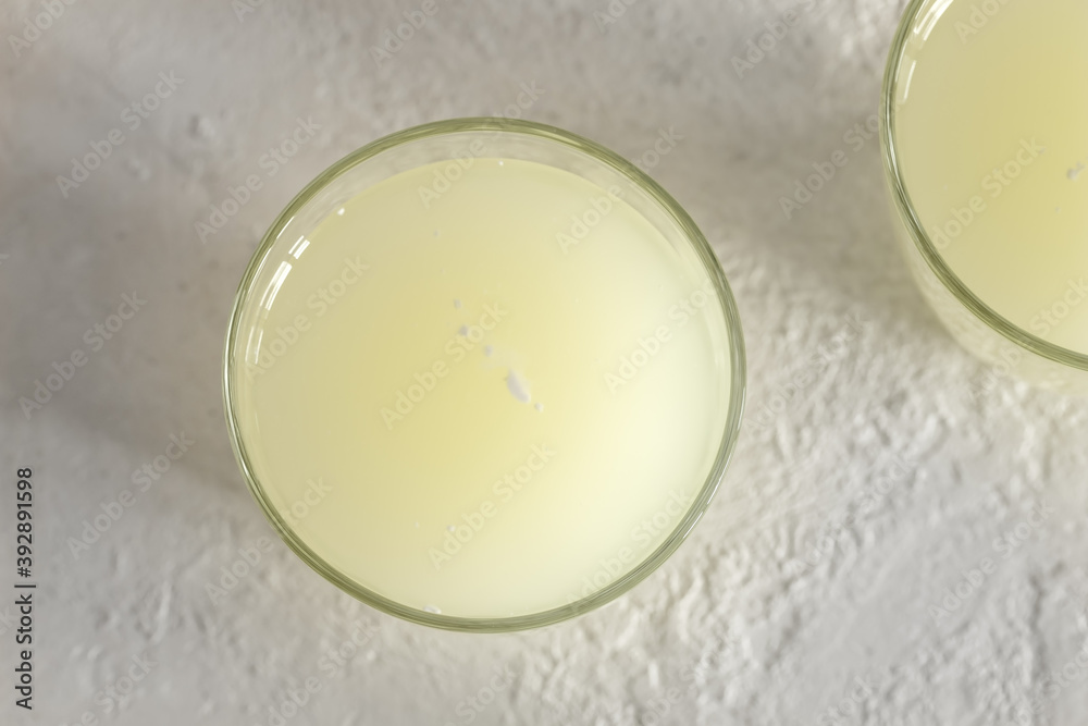 A glass of natural whey, top view A glass of natural whey, top view