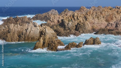 Beautiful shot of rock formations near the sea close to Beach Li Cossi, Sardinia, Italy.