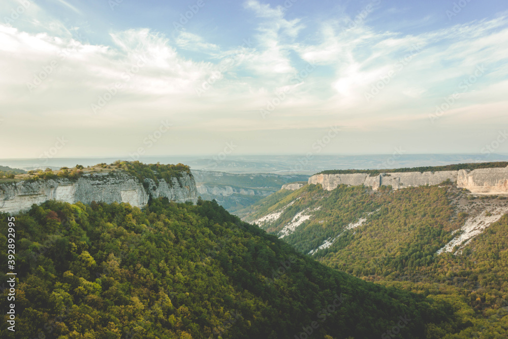 Scenic view of mountain landscape during dawn. Neat horizontal background with space for text copy