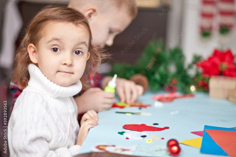 Kids making decor for Christmas tree or gifts. Christmas handmade diy project. Kids making decor for Christmas tree or gifts. Christmas handmade diy project.