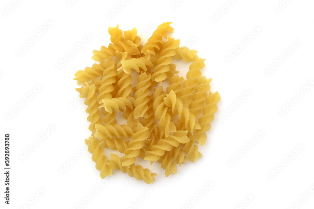 Spiral pasta lie in a heap on a white background Spiral pasta lie in a heap on a white background