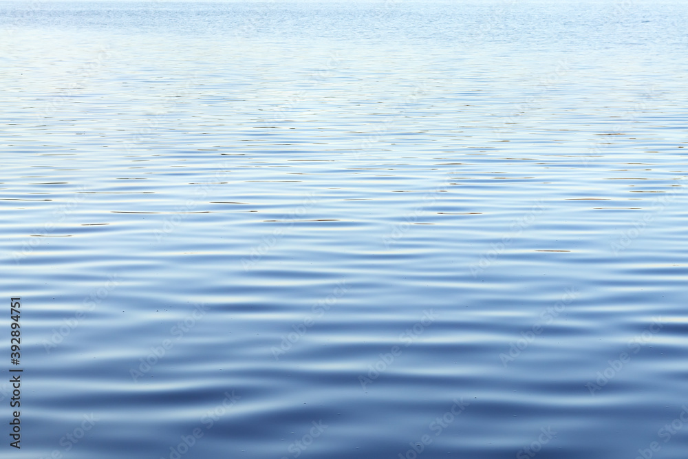 River water surface with waves as nature background. Ripple water texture. River water surface with waves as nature background. Ripple water texture.