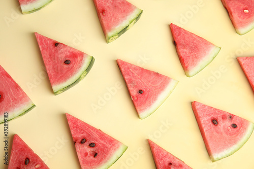 Slices of ripe watermelon on beige background, flat lay