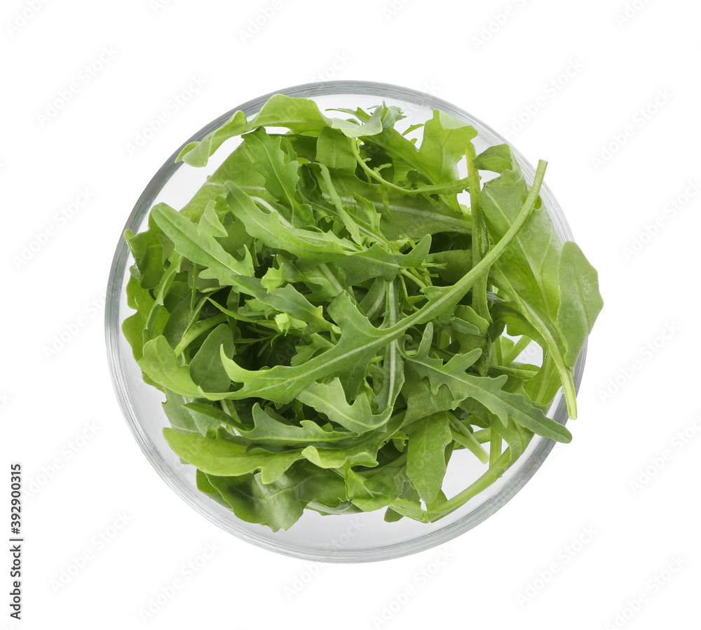 Delicious fresh arugula on glass bowl isolated on white, top view Delicious fresh arugula on glass bowl isolated on white, top view