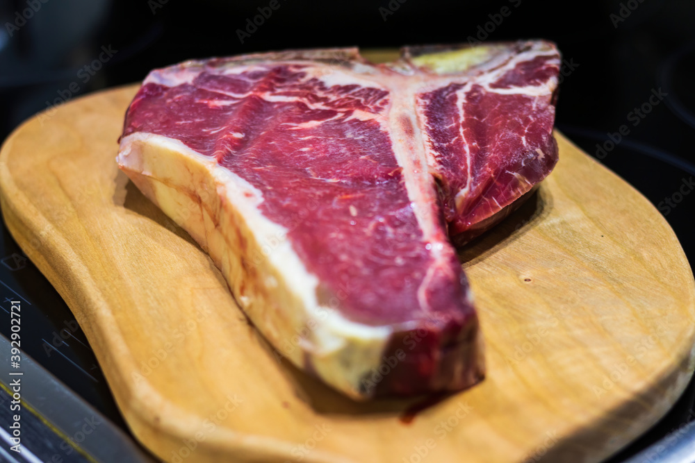 Raw prime T-Bone marbled beef steak ready for grill