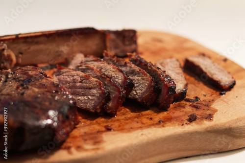 Grilled prime T-Bone marbled beef steak on a plate.
