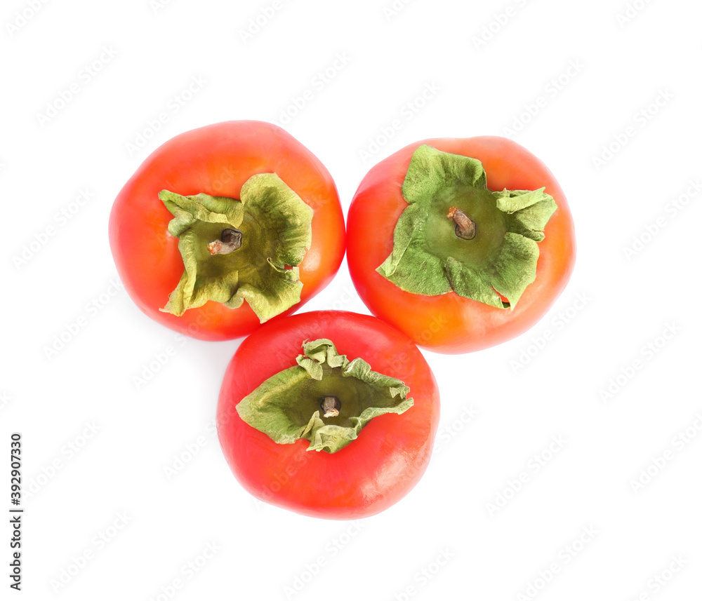 Delicious fresh ripe persimmons isolated on white, top view Delicious fresh ripe persimmons isolated on white, top view