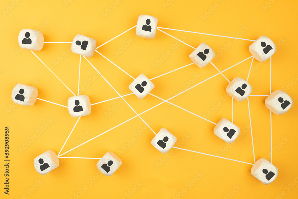 connections between people, social network concept with wooden blocks on colored background connections between people, social network concept with wooden blocks on colored background