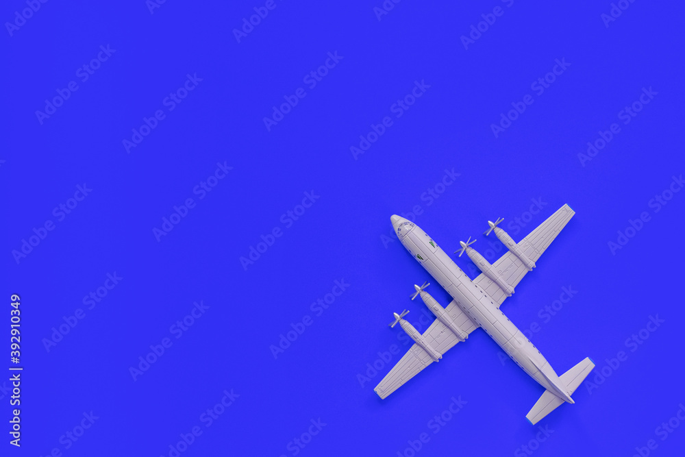 a toy plane on a bright colored background, the concept of resuming flights around the world after the coronavirus, restoring the finances of airlines and tour operators. a toy plane on a bright colored background, the concept of resuming flights around the world after the coronavirus, restoring the finances of airlines and tour operators.