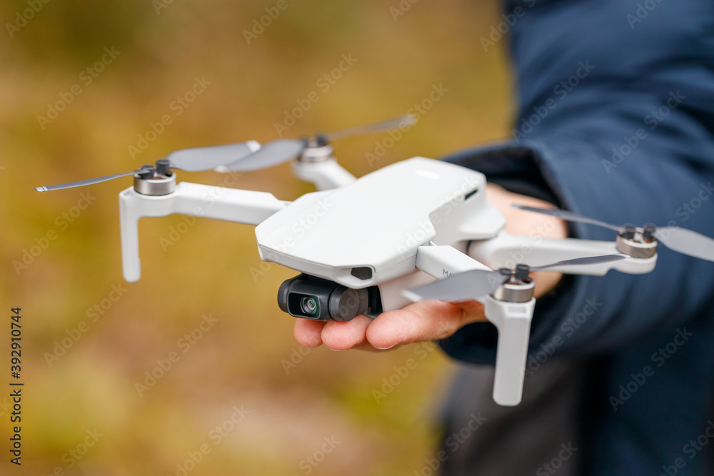 Vyborg, Russia - November 15, 2020: DJI mavic mini drone quadcopter in hand  man close-up. Stock Photo | Adobe Stock