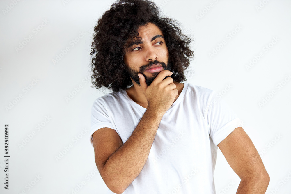 thoughtful bearded male is in contemplation, handsome guy in casual wear looking away, isolated over white background thoughtful bearded male is in contemplation, handsome guy in casual wear looking away, isolated over white background