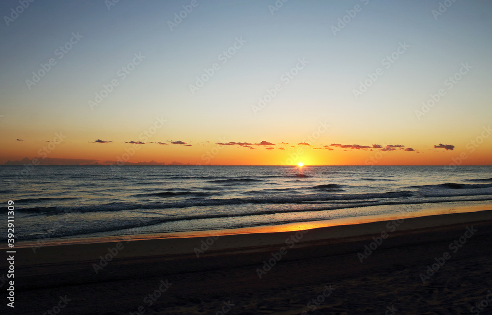 Golden sunrise on the beach, Mediterranean sea