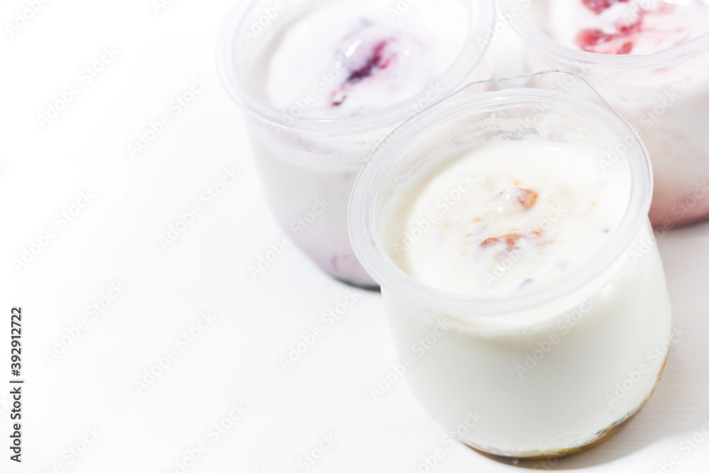 assortment of yogurts with fruit additives, top view assortment of yogurts with fruit additives, top view