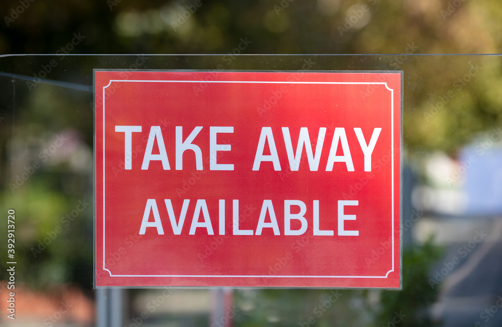 Take Away Available sign on restaurant glass partition