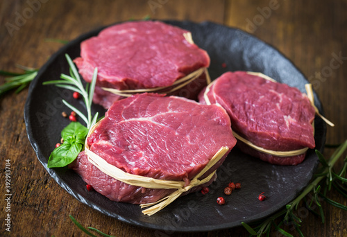 Raw organic beef steak with spices
