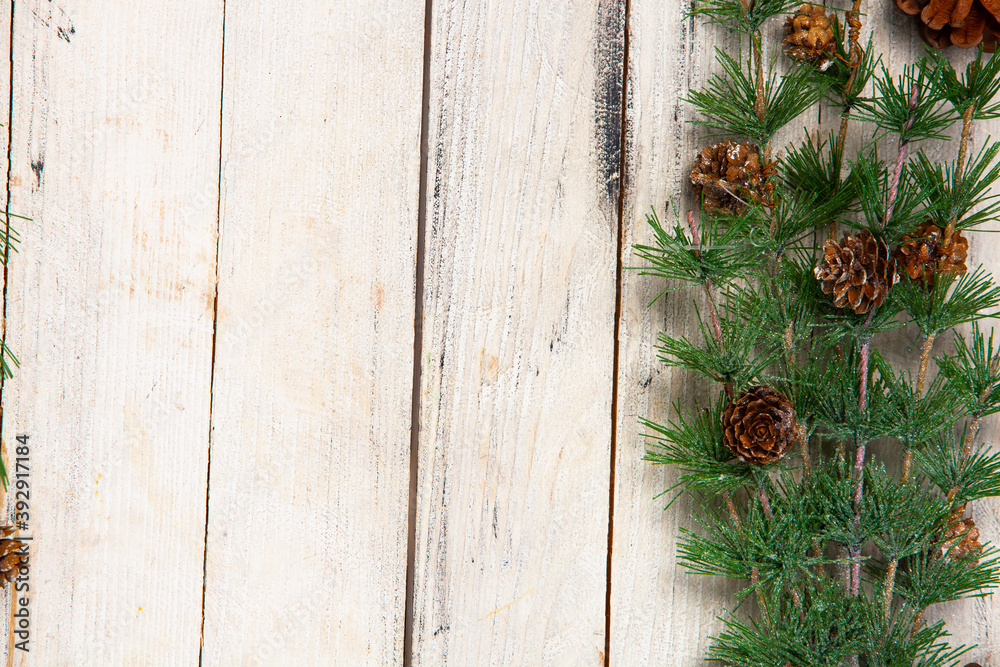 Happy New Year greeting card. Christmas branches on rustic wooden background. Space for text. Top view Happy New Year greeting card. Christmas branches on rustic wooden background. Space for text. Top view