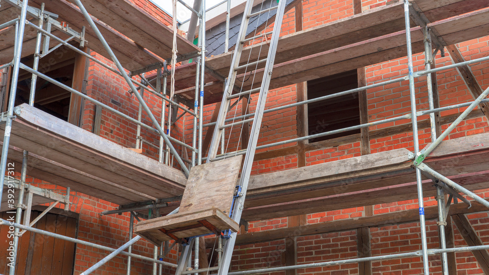 Old brick building with scaffolding Old brick building with scaffolding