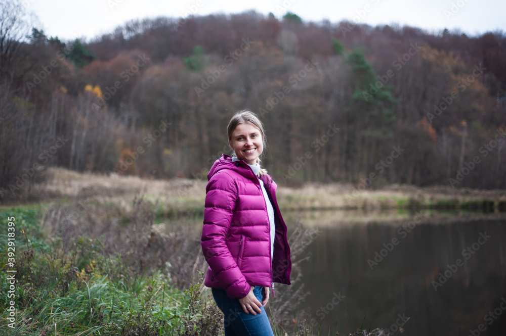 Smiling blonde woman autumn outdoor Smiling blonde woman autumn outdoor