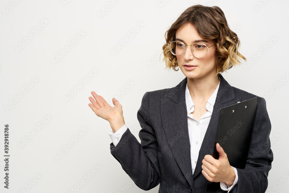 Woman in business suit finances work documents glasses hairstyle Woman in business suit finances work documents glasses hairstyle