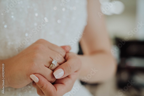 Hands of a bride with wedding rings close up
